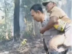 Bhabinkamtibmas Evakuasi Warga di Tengah Kepulan Asap Kebakaran